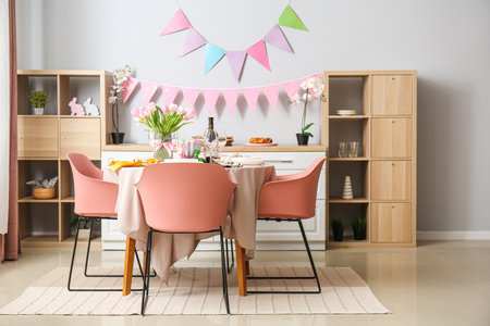 Interior of kitchen with festive table served for Easter celebration