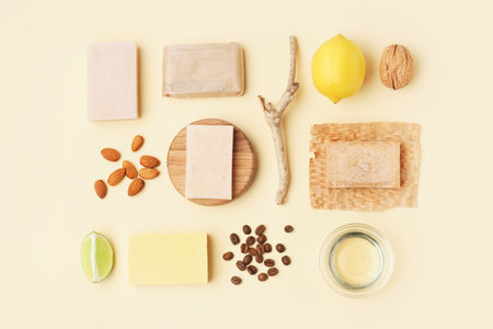 Composition with soap bars and natural ingredients on color background