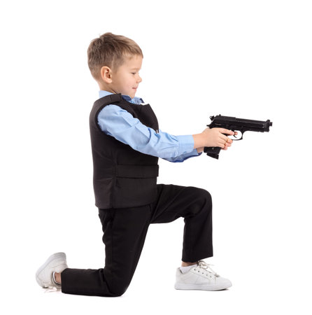 Funny little police officer with gun on white backgroundの写真素材