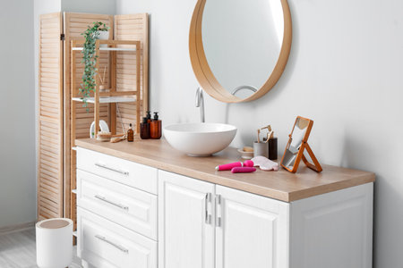 Counters with sink, sex toys and bath accessories in interior of bathroomの写真素材