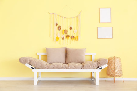 Stylish modern sofa in room