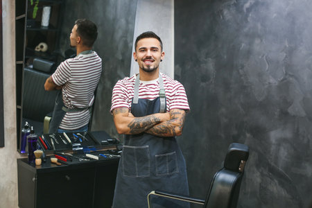 Professional hairdresser in barbershopの写真素材