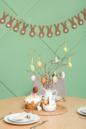 Interior of dining room with table served for Easter celebration