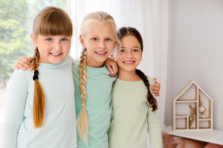 Cute little girls in bedroomの写真素材