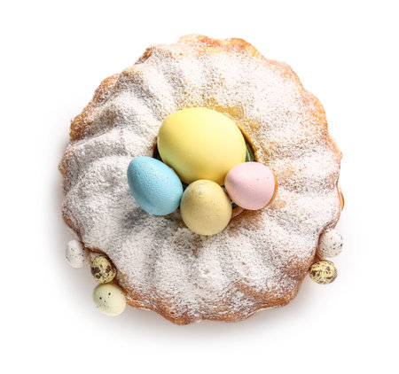 Tasty Easter cake and eggs isolated on white background