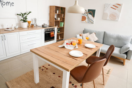 Interior of modern stylish kitchen with dining table