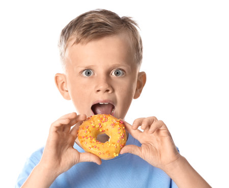 Funny little boy with donut on white backgroundの写真素材