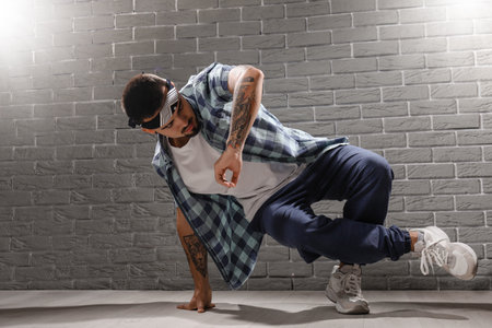 Male hip hop dancer in studioの写真素材