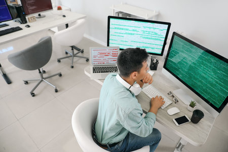 Male programmer working in office