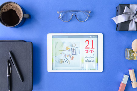 Composition with tablet computer and cosmetics on color background. online shopping conceptの写真素材