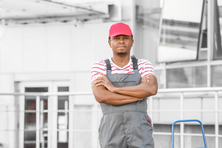 Portrait of African-American delivery man outdoorsの写真素材