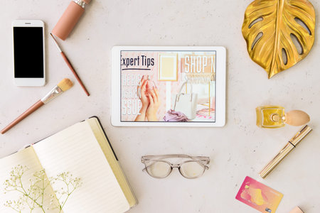 Composition with tablet computer on light background. online shopping concept