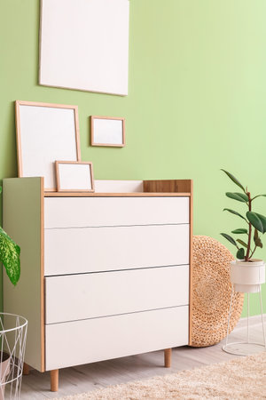 Modern chest of drawers in the interior of the room