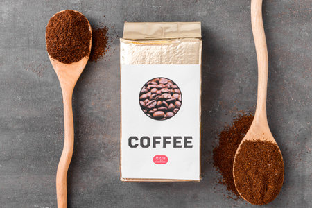 Pack with coffee and spoons on dark backgroundの写真素材