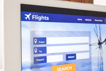 Open page of online booking service on screen of laptop, closeupの写真素材