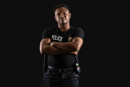 African-American police officer on dark backgroundの写真素材