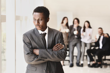 Lonely African-American businessman in office. stop racism