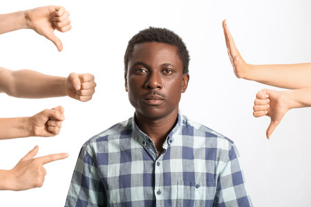 People bullying African-American man on white background. stop racismの写真素材