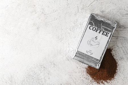 Pack with coffee powder on tableの写真素材