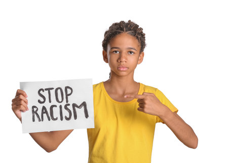 African-American girl with poster on white background. stop racismの写真素材