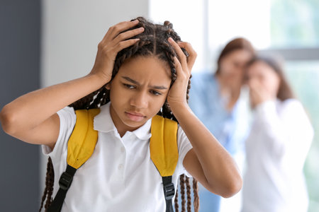 Pupils bullying African-American girl at school. stop racismの写真素材