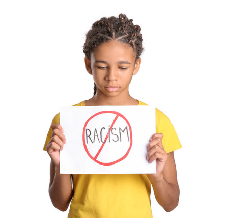 African-American girl with poster on white background. stop racismの写真素材