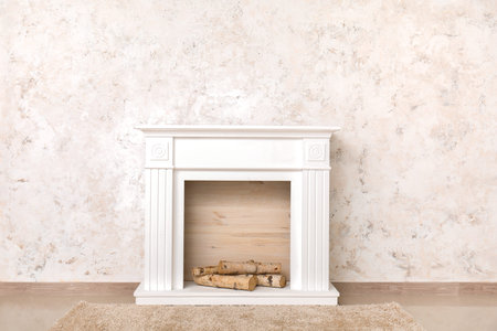 modern fireplace near wall in roomの写真素材