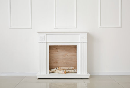 modern fireplace near wall in roomの写真素材