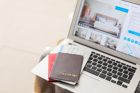 Open page of online booking service on screen of laptopの写真素材