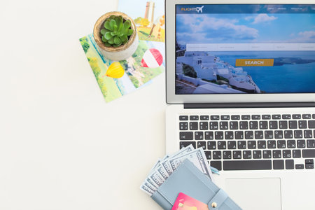 Open page of online booking service on screen of laptop on tableの写真素材