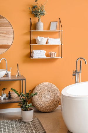 Stylish interior of modern bathroom with clean towelsの写真素材