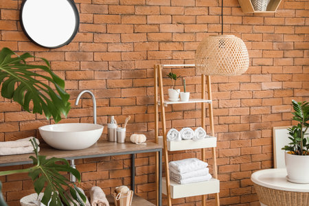 Stylish interior of modern bathroom with clean towelsの写真素材