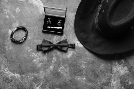 Set of male accessories with stylish bow tie on grunge backgroundの写真素材