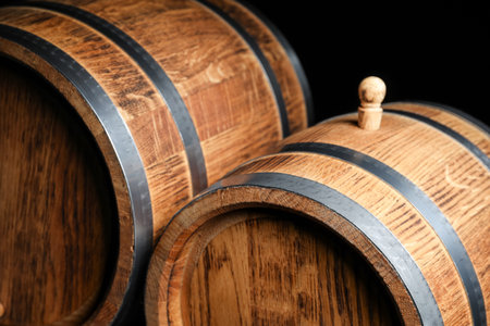 Wooden barrels on dark background, closeupの写真素材