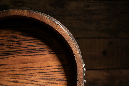 Oak barrel on wooden background, closeupの写真素材