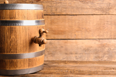 Oak barrel on wooden backgroundの写真素材