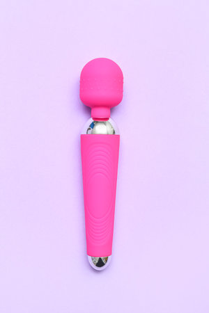 Pink vibrator from sex shop on lilac backgroundの写真素材