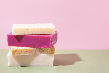Stack of natural soap bars on color backgroundの写真素材
