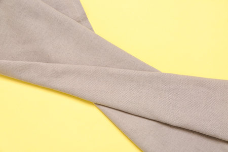 Clean napkin on yellow background, closeupの写真素材