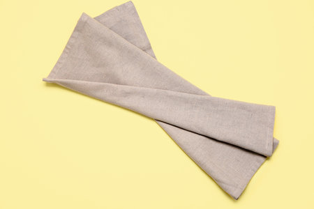 Clean napkin on yellow backgroundの写真素材
