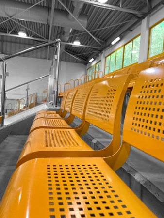 View of yellow seats in stadiumの写真素材
