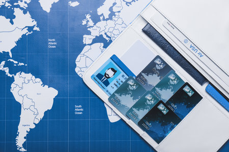 Travel organizer with different things on world mapの写真素材