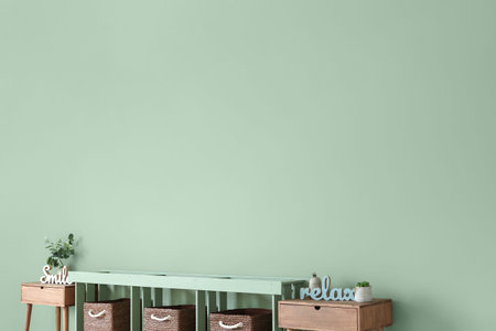 Shelf unit and tables near color wallの写真素材