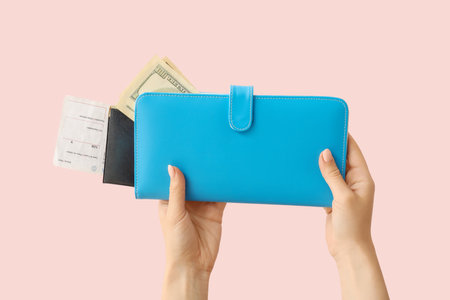 Female hands with travel organizer on color backgroundの写真素材