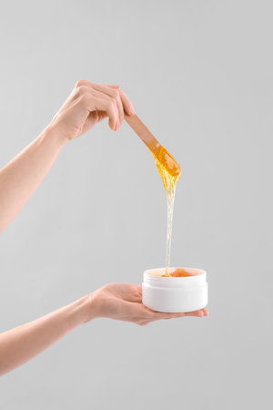 Hands with sugar paste on light backgroundの写真素材