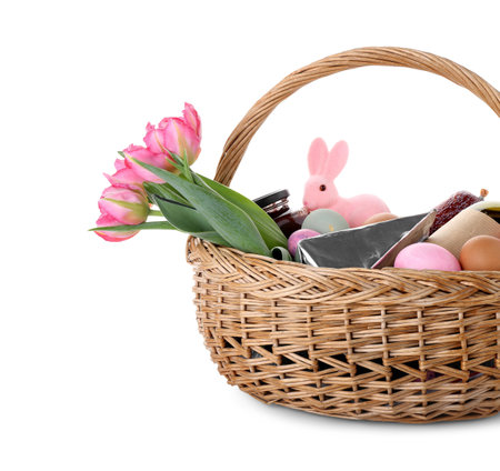 Basket with Easter eggs, tulip flowers and bunny isolated on white backgroundの写真素材