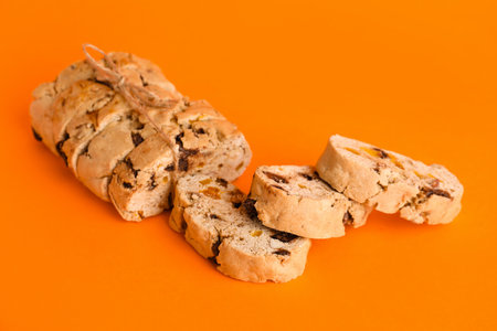 Delicious biscotti cookies on orange backgroundの写真素材