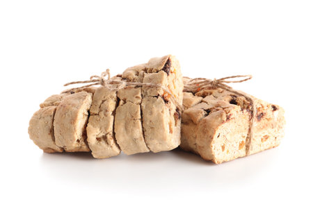 Delicious biscotti cookies tied with thread isolated on white backgroundの写真素材