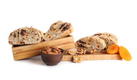 Board with delicious biscotti cookies, nuts and dried apricots isolated on white backgroundの写真素材
