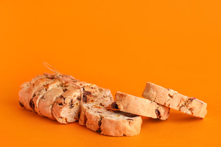 Delicious biscotti cookies on orange backgroundの写真素材